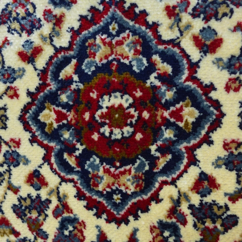 1497 - A full pile, red ground Cashmere runner, floral medallion design, 300cm x 80cm