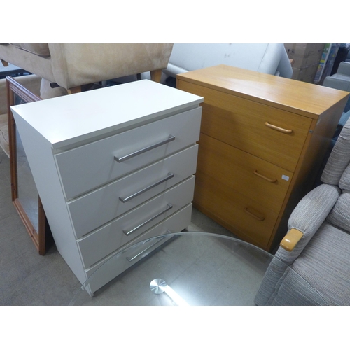 1586 - An oak chest of three drawers and a white chest of four drawers