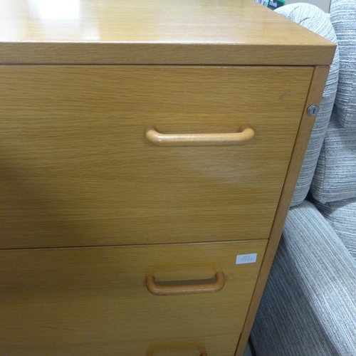 1586 - An oak chest of three drawers and a white chest of four drawers