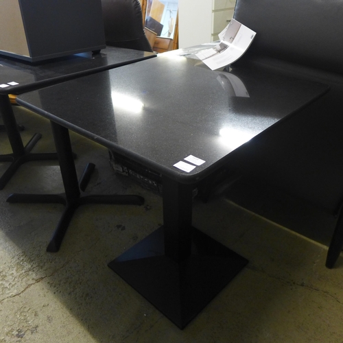 1616 - A black marble pub table with X base