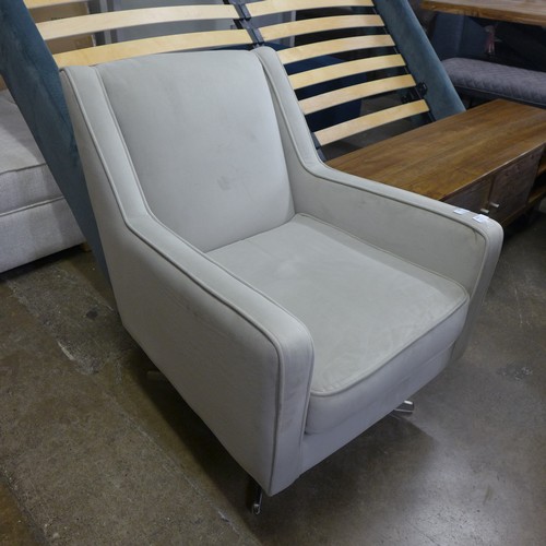 1381 - A sandstone velvet upholstered swivel side chair