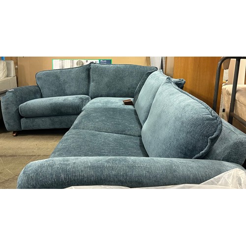 1569 - A blue textured weave upholstered corner sofa - damaged legs