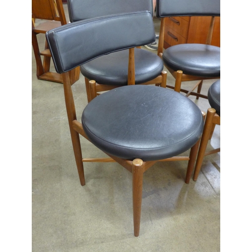 10 - A set of four G-Plan Fresco teak and black vinyl dining chairs