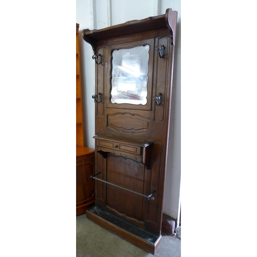 105 - An early 20th Century French carved oak hallstand