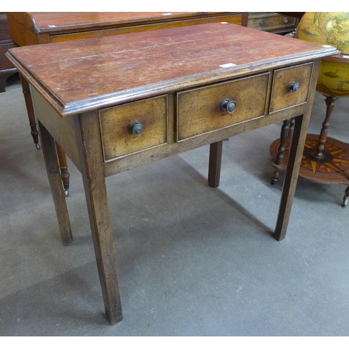 112 - A George III mahogany three drawer lowboy