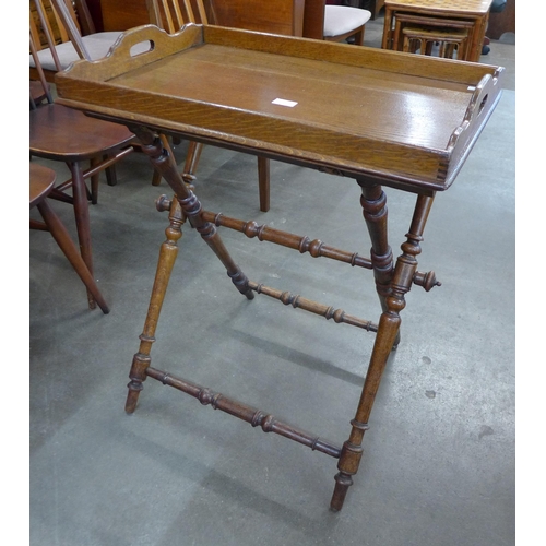 116 - A Victorian oak butler's tray and stand