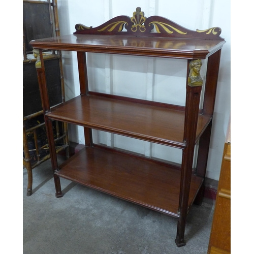 121 - A 19th Century French Empire style mahogany and brass inlaid three tier dumb waiter