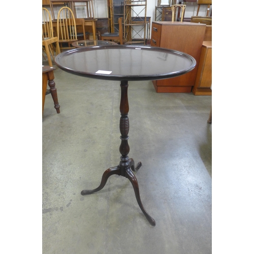 123B - A George III mahogany tripod wine table