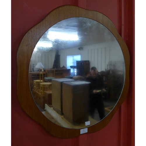 13 - A teak framed mirror