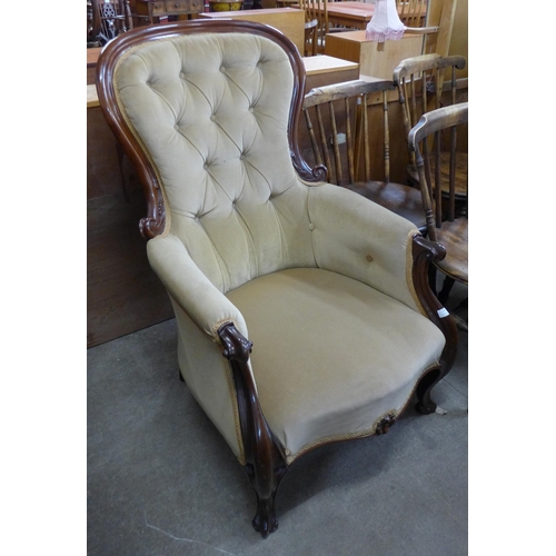 132 - A Victorian mahogany and upholstered armchair