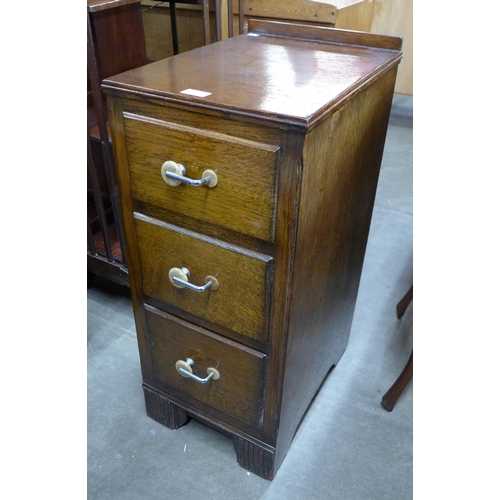 135 - An Art Deco oak pedestal chest of drawers