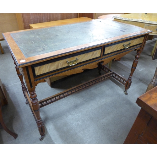 138 - A Victorian Aesthetic Movement walnut and green leather topped two drawer writing table