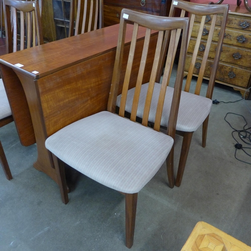 14 - A G-Plan Fresco teak drop-leaf table and four chairs