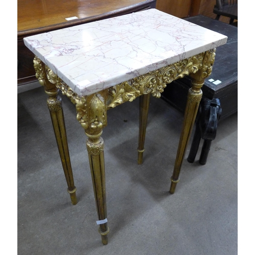 143 - A French Louis XV style giltwood and marble topped gueridon table