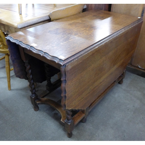 147 - An oak barleytwist gateleg table