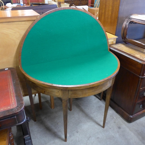 152 - A George III inlaid walnut demi-lune fold over card table