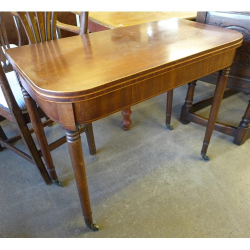 164 - A George IV inlaid mahogany D-shaped fold over tea table