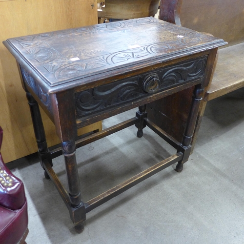 170 - A 17th Century style carved oak single drawer side table