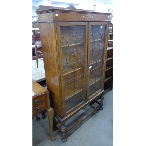 173 - An early 20th Century oak two door bookcase