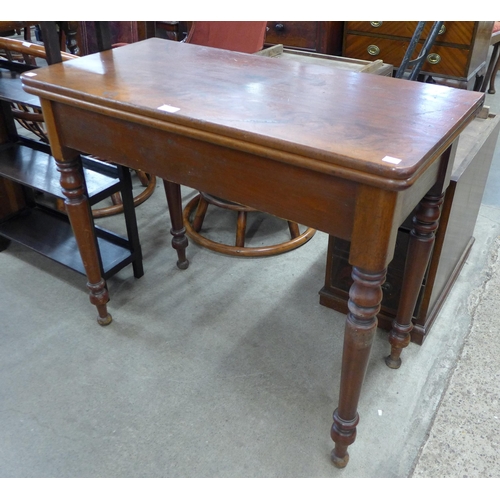 176 - A Victorian mahogany fold over tea table