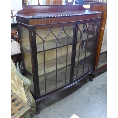 179 - A mahogany bow front two door display cabinet