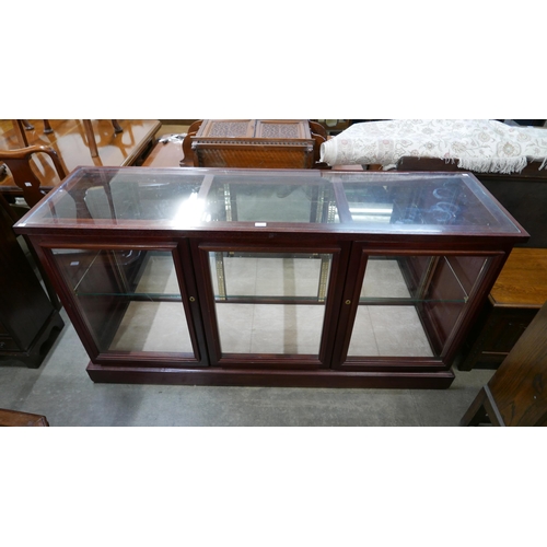 182 - A mahogany three door shop counter