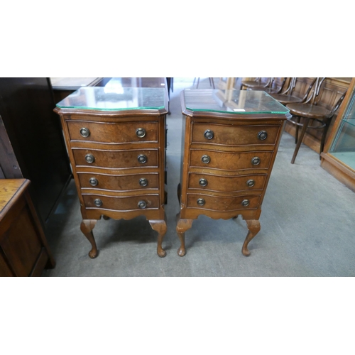 184 - A pair of small burr walnut serpentine chests of drawers