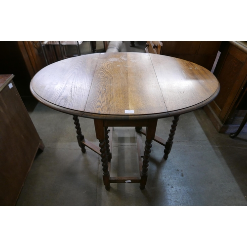 186 - An oak barleytwist gateleg table