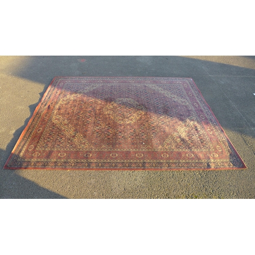 192 - A Persian pink and blue rug, 4.1 x 3.2m