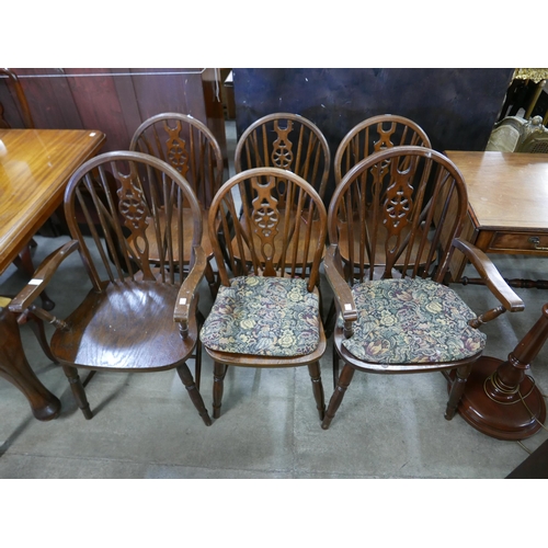 194 - A set of six oak and beech wheelback chairs