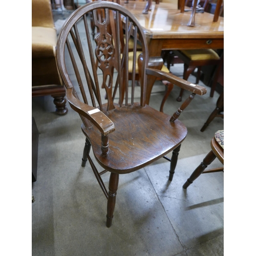 194 - A set of six oak and beech wheelback chairs