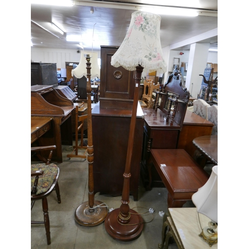 196 - An oak standard lamp and a mahogany standard lamp