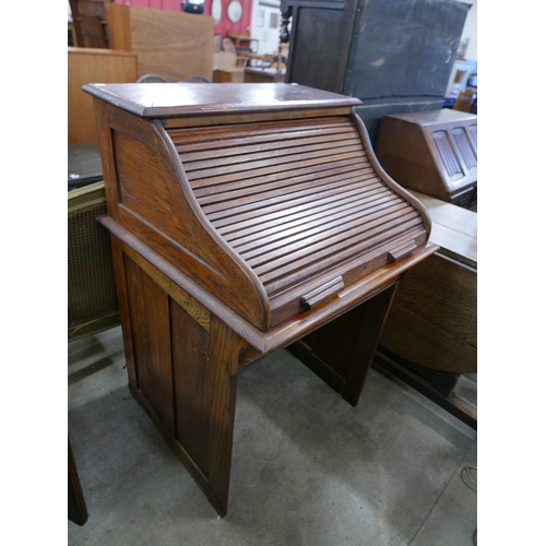 198 - An early 20th Century oak tambour roll top desk