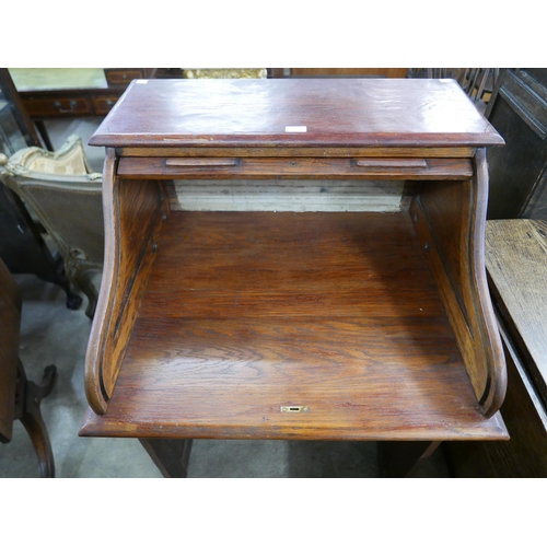 198 - An early 20th Century oak tambour roll top desk