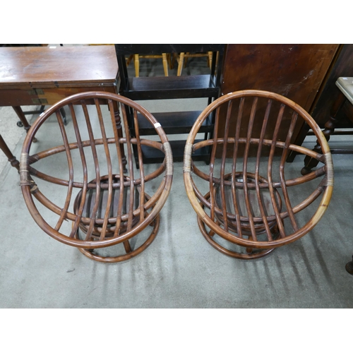 200 - A pair of Angraves bamboo revolving chairs