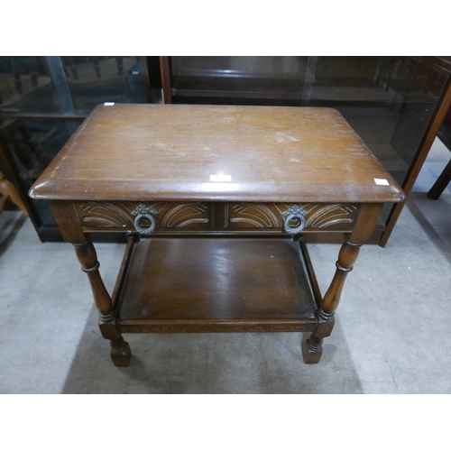 205 - A small oak single drawer side table and a small oak drop-leaf occasional table