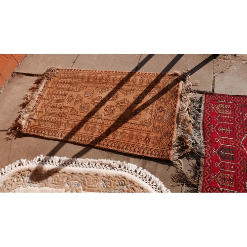 237 - Two double sided red ground prayer rugs, another red ground rug and two others