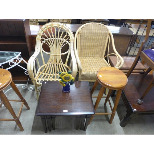 246 - Two pine stools, two cane chairs, a wrought iron demi-lune console table, a pine bookcase, etc.(8)