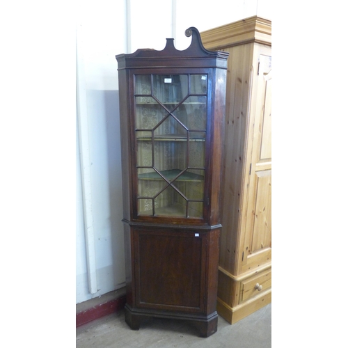 252 - An Edward VII mahogany corner cabinet