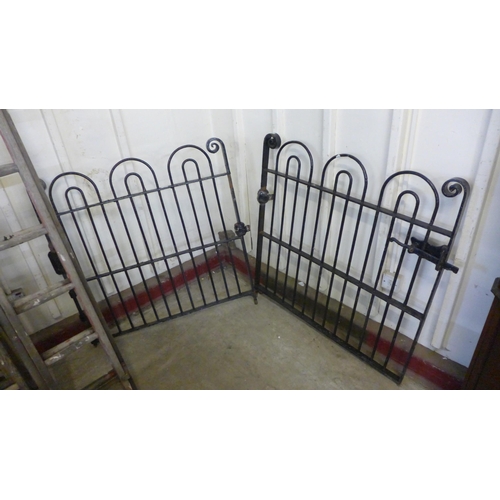 255 - A pair of 1930s bow top wrought iron gates