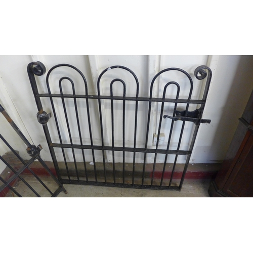 255 - A pair of 1930s bow top wrought iron gates