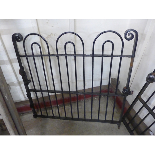 255 - A pair of 1930s bow top wrought iron gates