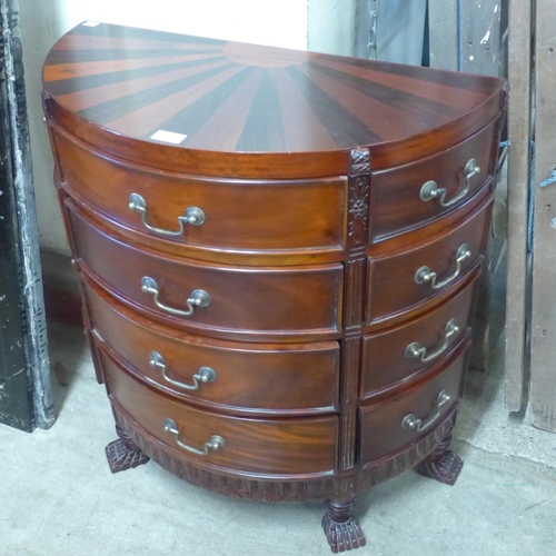 257 - A hardwood demi lune bank of drawers