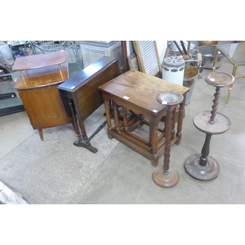 259 - A Victorian mahogany Pembroke table, an oak nest of tables, a walnut pot cupboard and two oak barley... 