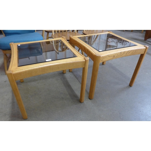 3 - A pair of Ercol Blonde glass topped ash coffee tables