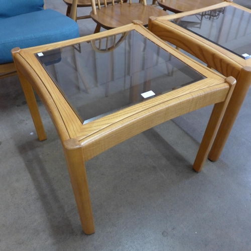 3 - A pair of Ercol Blonde glass topped ash coffee tables