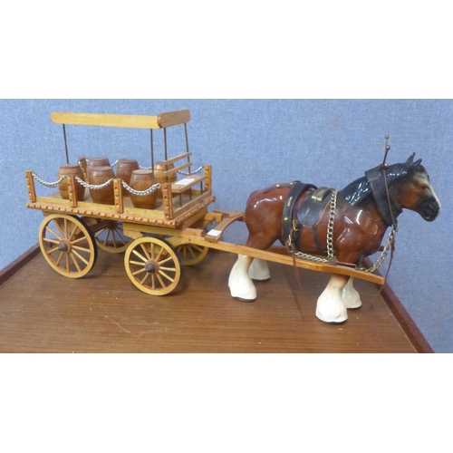 330 - A porcelain Shire horse with wooden cart