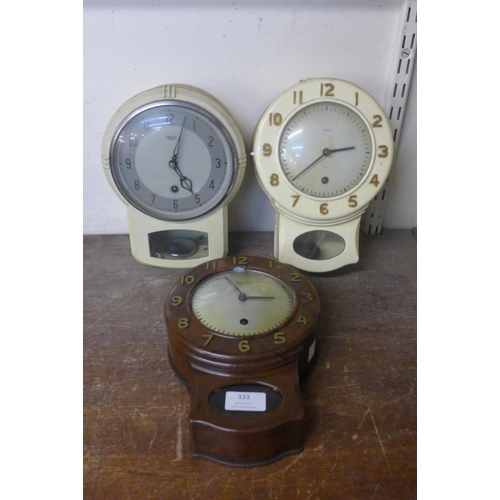 333 - A vintage Smiths faux rosewood wall clock and two others