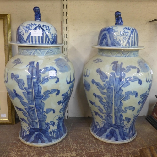 345 - A pair of Chinese blue and white porcelain vases and covers