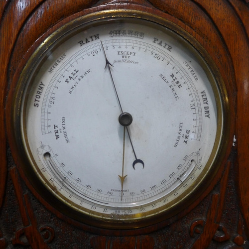 346 - Two Victorian carved oak aneroid barometers